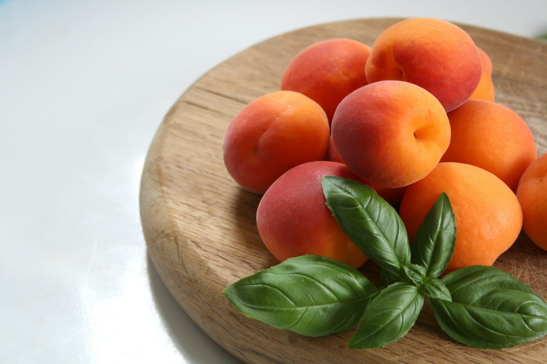 Fresh apricots on a wooden board
