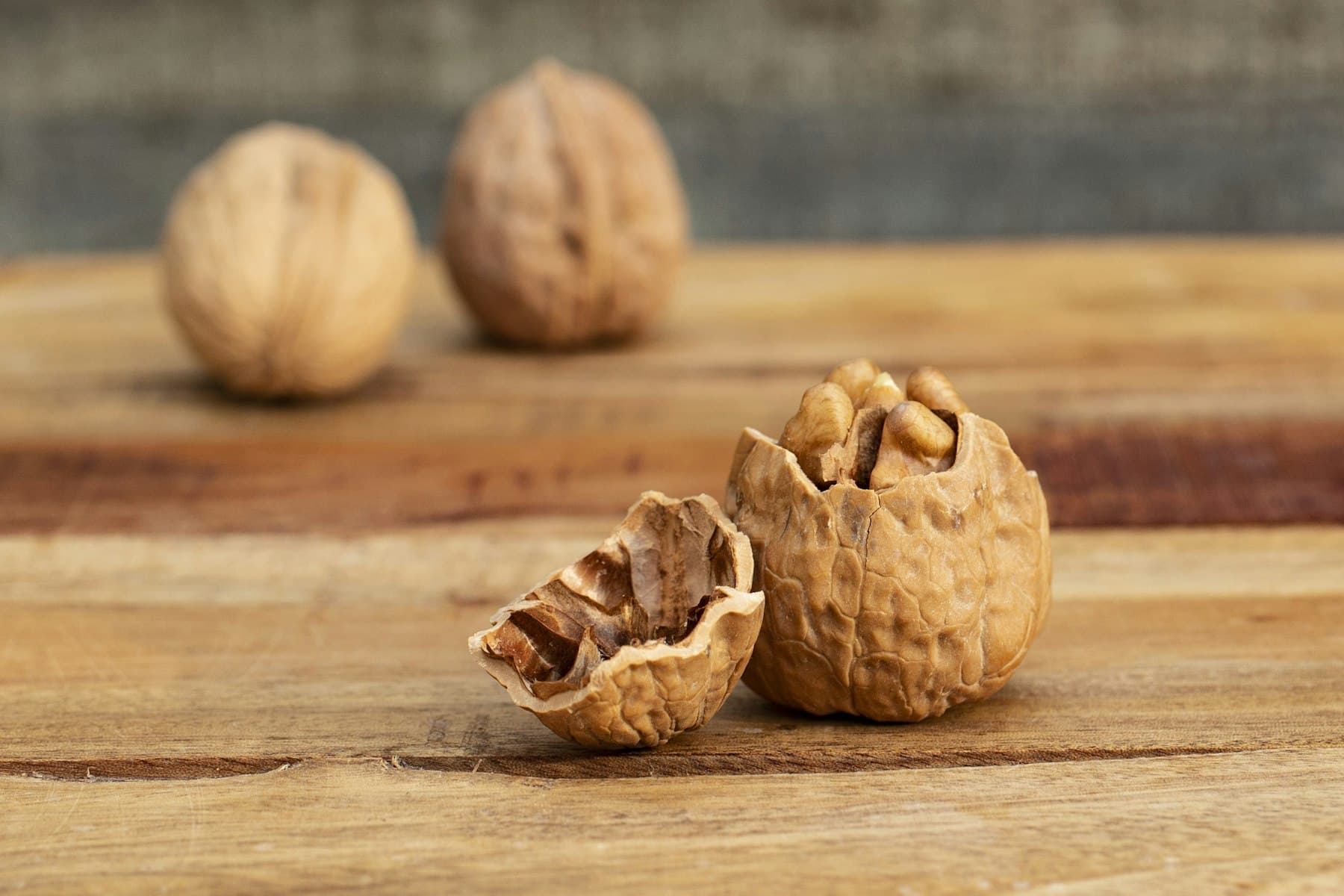 Cracked walnuts on a wooden table